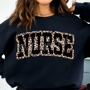 May include: Black sweatshirt with a leopard print "NURSE" graphic.