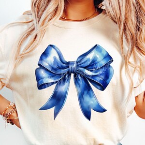 May include: A blue watercolor bow with a white background. The bow is tied in a knot and the ends are flowing.