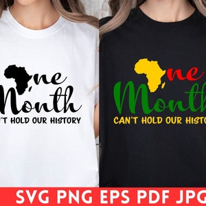 May include: Two t-shirts, one white and one black, each with a graphic design. The design includes the text "One Month" with a map of Africa and the phrase "Can't Hold Our History". The white shirt has a black design, while the black shirt has a green, yellow, and red design.