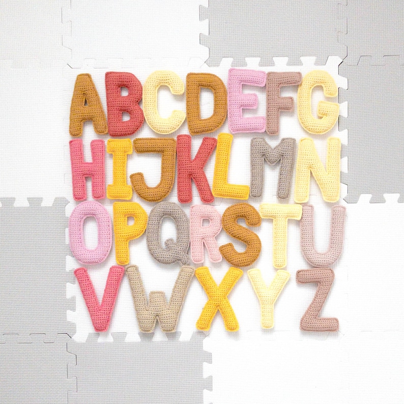Crochet alphabet letters from a crochet alphabet pattern, suitable as a Montessori toy for learning letters.