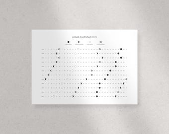 May include: A black and white lunar calendar for the year 2025. The calendar shows the phases of the moon for each day of the year. The phases include new moon, first quarter, full moon, and last quarter.