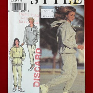 May include: A sewing pattern envelope labeled Style 2341, size A (8-18). The front displays illustrations and a photograph of a hooded sweatshirt and matching sweatpants. The text includes Style, 2341, size A (8-18), and Pattern/Patron.