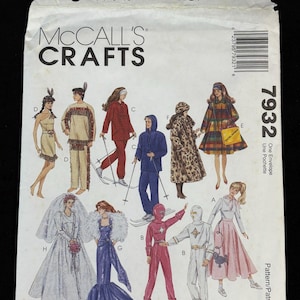 May include: McCall's Crafts sewing pattern envelope featuring illustrations of various outfits, including a Native American-inspired dress, ski attire, a leopard print coat, and a wedding dress. The envelope includes the text "McCall's Closet" and "La Garde-Robe de McCall's".