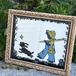 May include: A white ceramic mug with a black handle and the text "But First, Coffee" in a black, handwritten-style font. The mug is on a white surface.