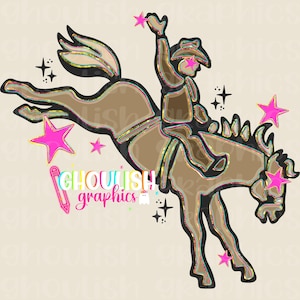 May include: A digital illustration of a rodeo cowboy riding a bucking bronco. The cowboy is wearing a brown outfit and hat, with pink stars and sparkles surrounding the image. The text "Ghoulish Graphics" is also included.