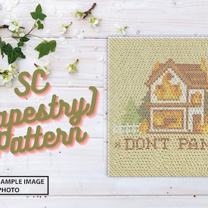 May include: A beige tapestry pattern with a house and the text "DON'T PANIC". The pattern is a symbolic sample image, not a photo.