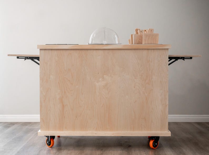 Charcuterie cart with wooden top and stainless steel containers and wooden boards