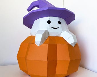 May include: A white ghost wearing a purple hat sits inside an orange pumpkin. The ghost has a smiling face and is holding the pumpkin with its arms.