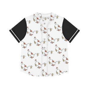 May include: White baseball jersey featuring a floral design in peach, cream, and brown hues. The sleeves are black with white trim, and the jersey has a button-up front. A distinctive top for everyday wear.
