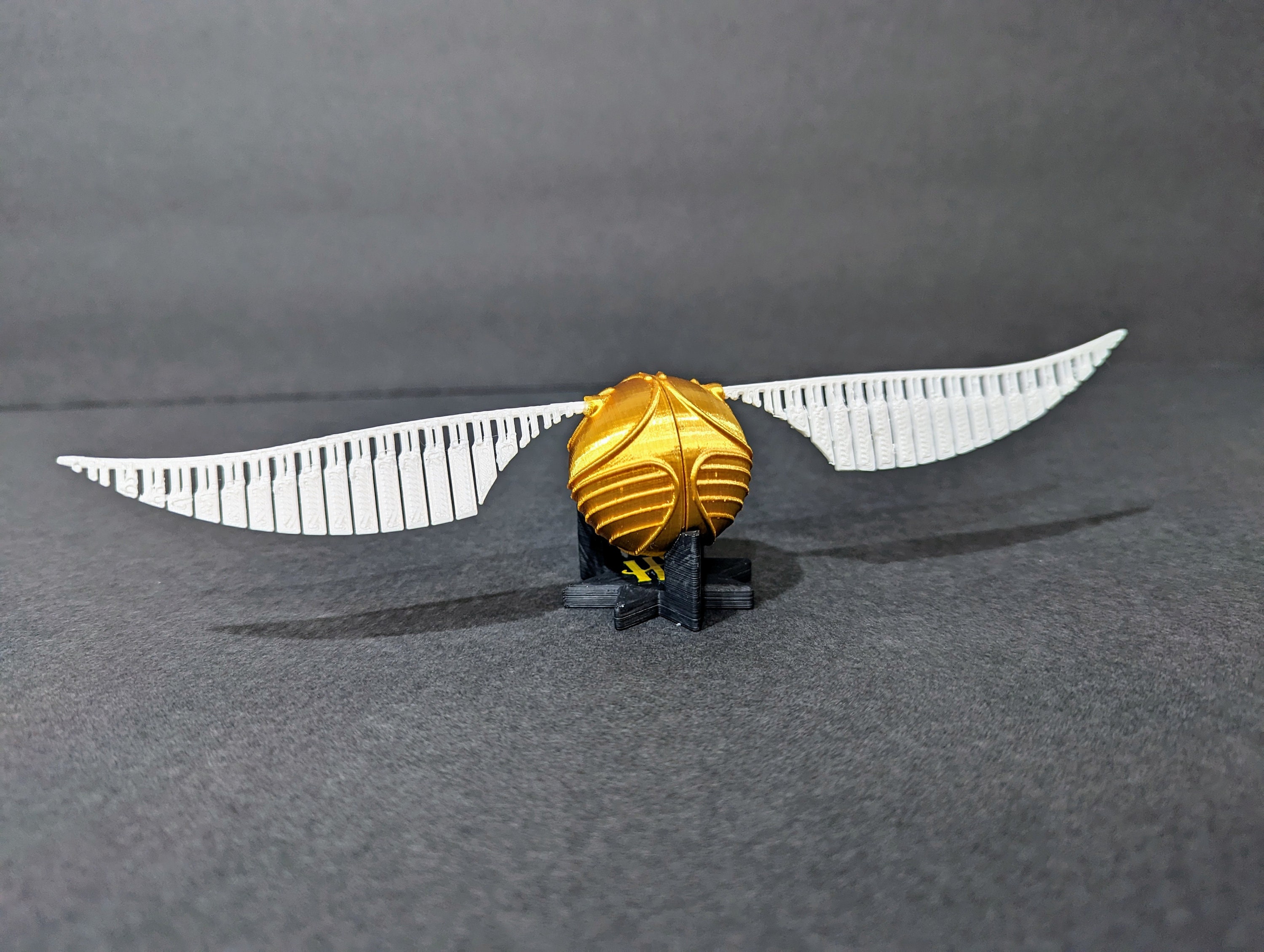 Harry Potter's Golden Snitch with adjustable wings