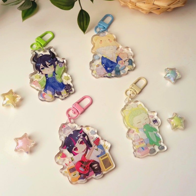 twisted wonderland keychains of malleus draconia, silver, sebek zigvolt, and lilia vanrouge