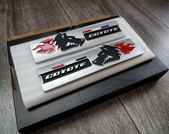 Matte Black Coyote Racing Emblem Badge Set (Pair) – Red Eyes, Adhesive Mount