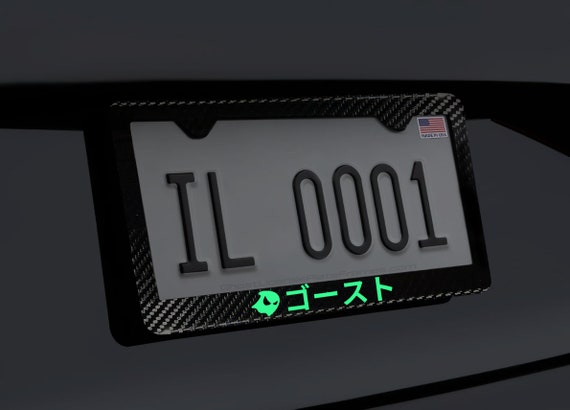 License Plate Holder Jdm JDM Mugen Glow In The Dark Green Logo Carbon Fiber License Plate Frame – Stainless Steel, 12.25" X 6.25" AMG Carbon Fiber License Plate Frame - Foto 2