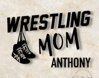 May include: Black and white graphic design with the text "Wrestling Mom Anthony". The design features a pair of wrestling shoes hanging from the word "Wrestling".