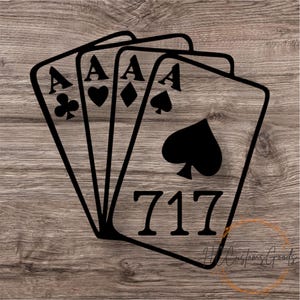 May include: Black graphic of four playing cards, each displaying an Ace. The Ace of Spades is prominent, with the number "717" below. The cards are set against a wood grain background.