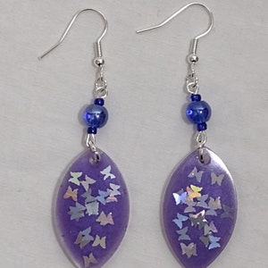 Purple resin marquise shaped earrings with butterfly glitter & beads