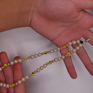 Good Quality Plastic Pearl, Evil Eye, Yellow Handmade Phone Charm Accessory.