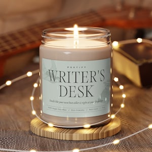 lit writer's desk candle is sitting around the holiday atmosphere