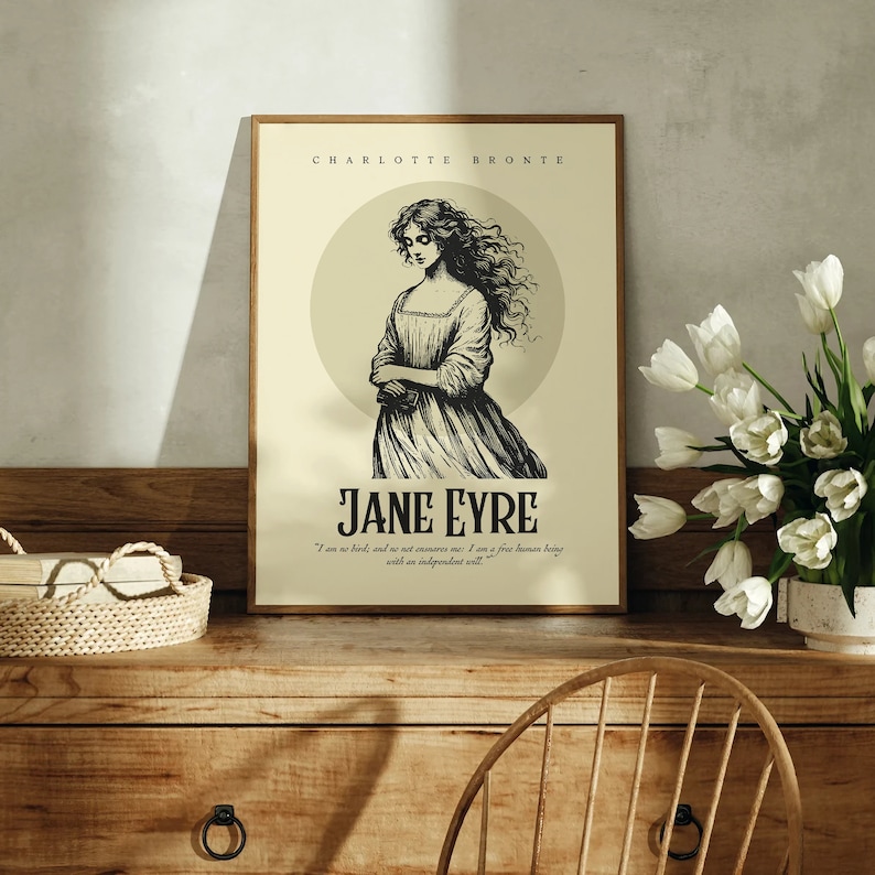 May include: A vintage-style poster featuring a black and white illustration of a woman with long hair, titled "Jane Eyre" by Charlotte Bronte. The poster has a cream background with a circle behind the woman. The quote "I am no bird, and no net ensnares me: I am a free human being with an independent will." is printed below the title.
