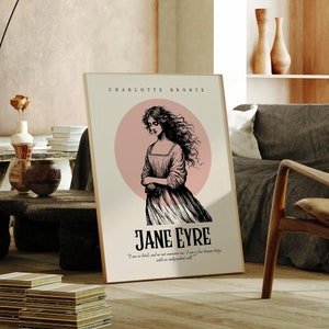 May include: A black and white illustration of a woman with long dark hair standing in a pink circle. The text "CHARLOTTE BRONTE" and "JANE EYRE" is printed above and below the illustration. A quote from the book is printed below the title.