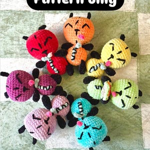 May include: A crochet pattern for making a set of colorful amigurumi ants. The ants are crocheted in a variety of colors, including red, orange, yellow, green, blue, and purple. Each ant has a cute face with black eyes and a smiling mouth. The pattern is available for download.