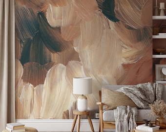 Pode incluir: Um interior de sala de estar com um sofá, uma mesa auxiliar e uma lâmpada. A parede é decorada com uma grande pintura abstrata em tons de marrom, bege e verde.