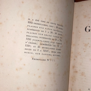 May include: A close-up of a page from a book with text describing the different types of paper used to print the book. The text reads: "IL A ÉTÉ TIRÉ DE CETTE ÉDITION 1345 EXEMPLAIRES, SOIT: 20 EXEM- PLAIRES SUR JAPON IMPÉRIAL, NUMÉROTÉS DE 1 A 20; 50 EXEM- PLAIRES SUR GRAND VERGÉ DE HOLLANDE, NUMÉROTÉS DE 21 A 70; 1250 EXEMPLAIRES SUR VERGÉ D'ARCHES, NUMÉROTÉS DE 71 A 1320; ET 25 EXEMPLAIRES NUMÉ- ROTÉS DE I A XXV, HORS COM- MERCE, SUR PAPIERS DIVERS. EXEMPLAIRE N° 131"