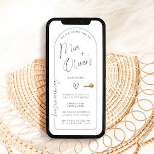Modern Minimal Black and White House Warming Invitation with an arch doorway and gold handle
