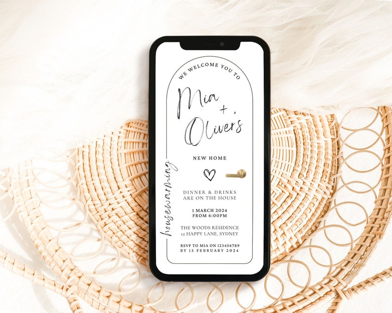 Modern Minimal Black and White House Warming Invitation with an arch doorway and gold handle