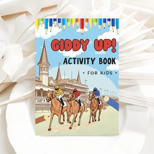 May include: An activity book for kids with the words "Giddy Up!" in red letters. The cover features a horse race scene with three jockeys on brown horses, a blue sky, and colorful pencils at the top.