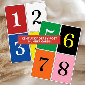 May include: A collection of Kentucky Derby Post Number Cards. Each card features a large number in a bold font against a solid background of red, white, blue, green, black, yellow, orange, and pink. The cards are rectangular with rounded corners.