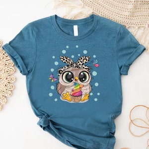 a t - shirt with an image of an owl on it