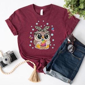 a women's t - shirt with an owl on it