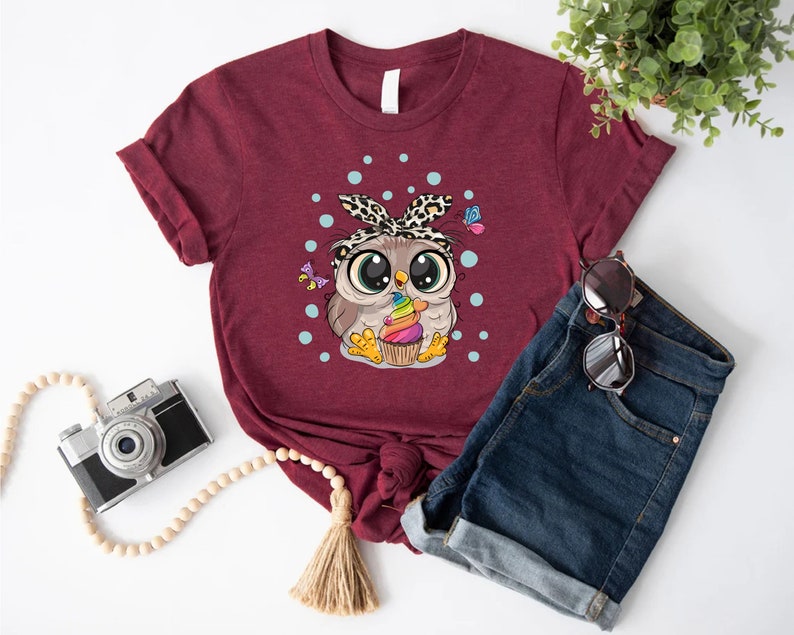 a women's t - shirt with an owl on it