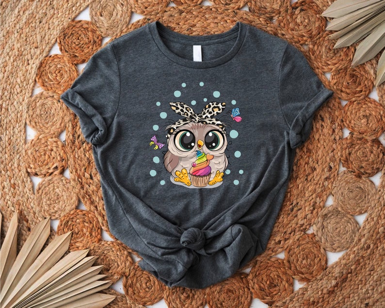 a women's t - shirt with an image of an owl on it