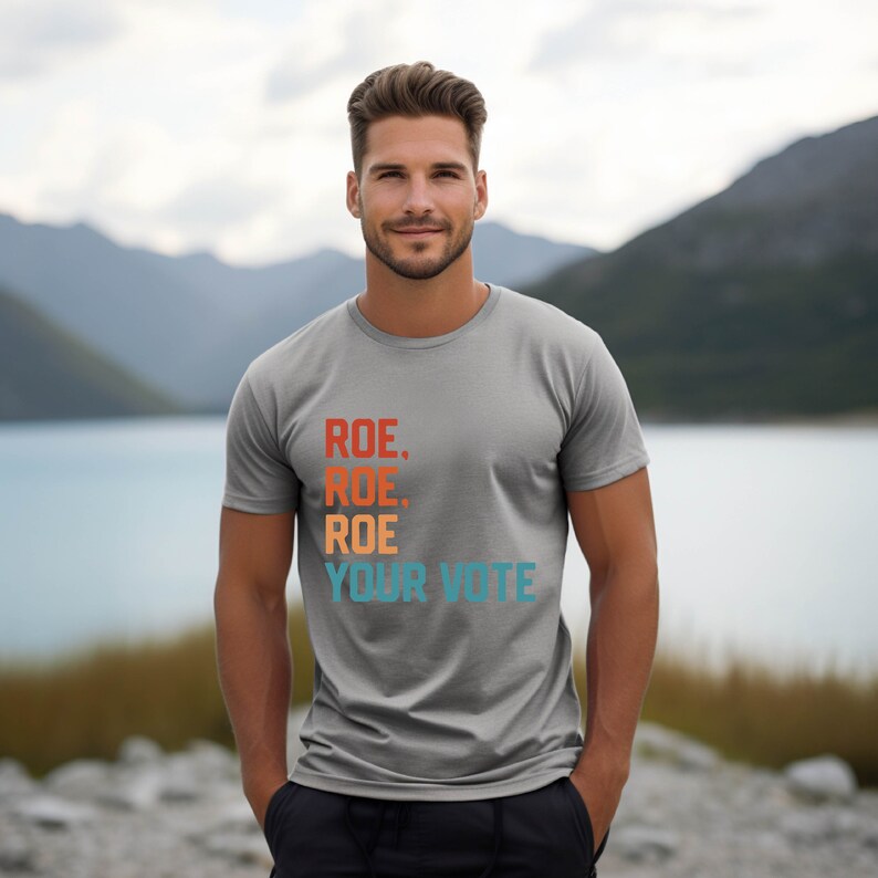 a man standing in front of a body of water