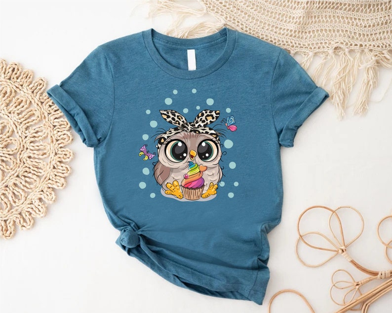 a t - shirt with an image of an owl on it