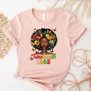 a t - shirt with a woman's face and flowers on it