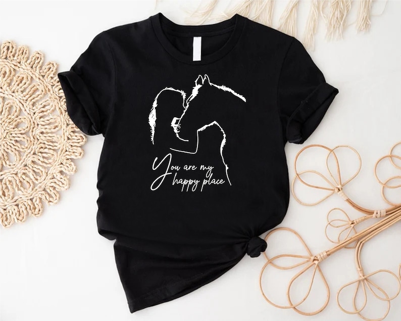 a t - shirt with a picture of a man kissing a woman