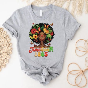 a t - shirt with a picture of a woman with flowers on it