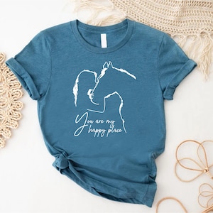 a t - shirt with a picture of a man and a woman kissing