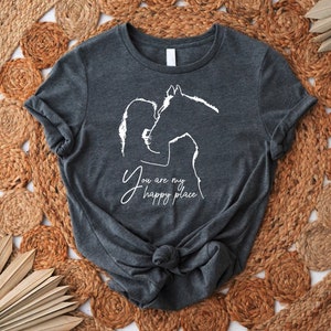 a t - shirt with a horse drawn on it