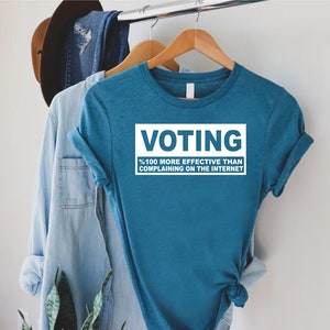 a blue shirt that says voting on it