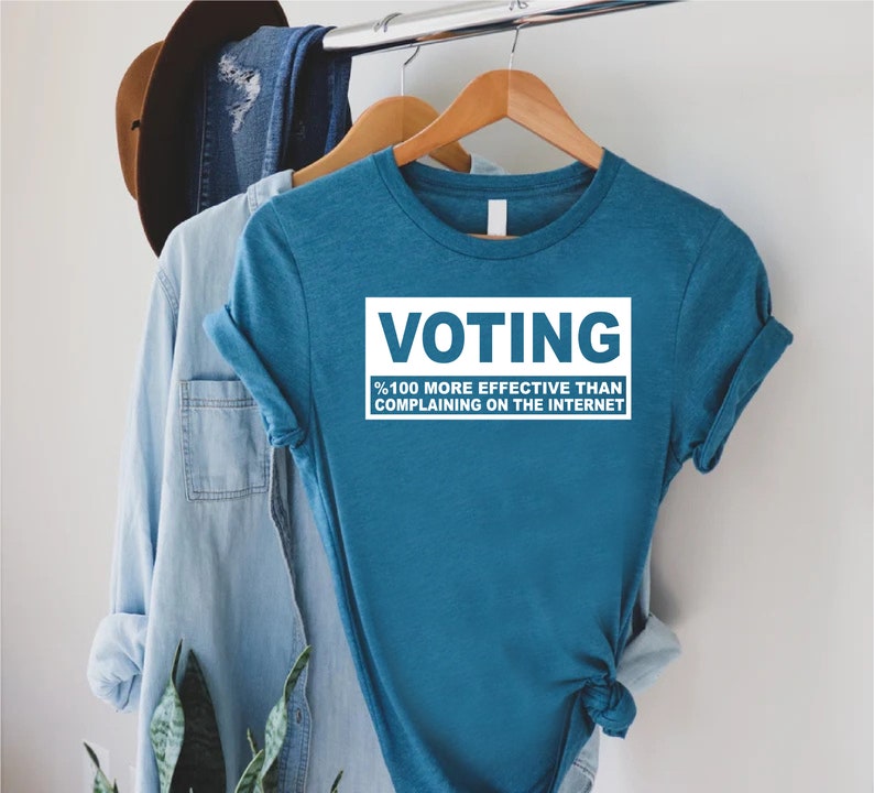 a blue shirt that says voting on it