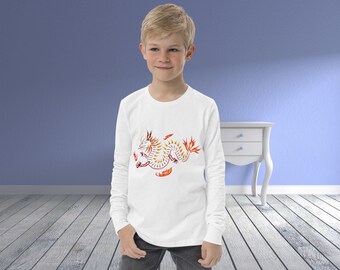May include: A white long-sleeve shirt with a graphic of a red and yellow dragon on the front.