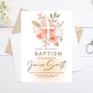 May include: A white card with a watercolour floral design in shades of peach and green. The design features a white cross in the centre. The text on the card reads "Please, join us for a Baptism of our daughter Janica Smith. Saturday, at 2:00 PM, 123 Anywhere St, Any City. Rsvp to Mia before January 25th. phone +123-456-7890"