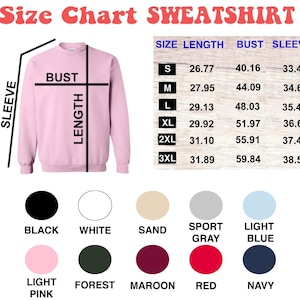 May include: Size chart for a sweatshirt with measurements in inches for length, bust, and sleeve. The chart shows sizes from S to 3XL. The colors available are black, white, sand, sport gray, light blue, light pink, forest, maroon, red, and navy.