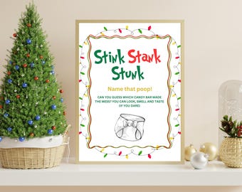 以下が含まれることがあります： 緑と赤で「Stink Stank Stunk」という言葉が書かれた、額入りのクリスマスをテーマにしたサイン。サインには「うんちの名前は？」というテキストと、おむつの絵が含まれています。装飾されたクリスマスツリーとオーナメントが背景にあります。