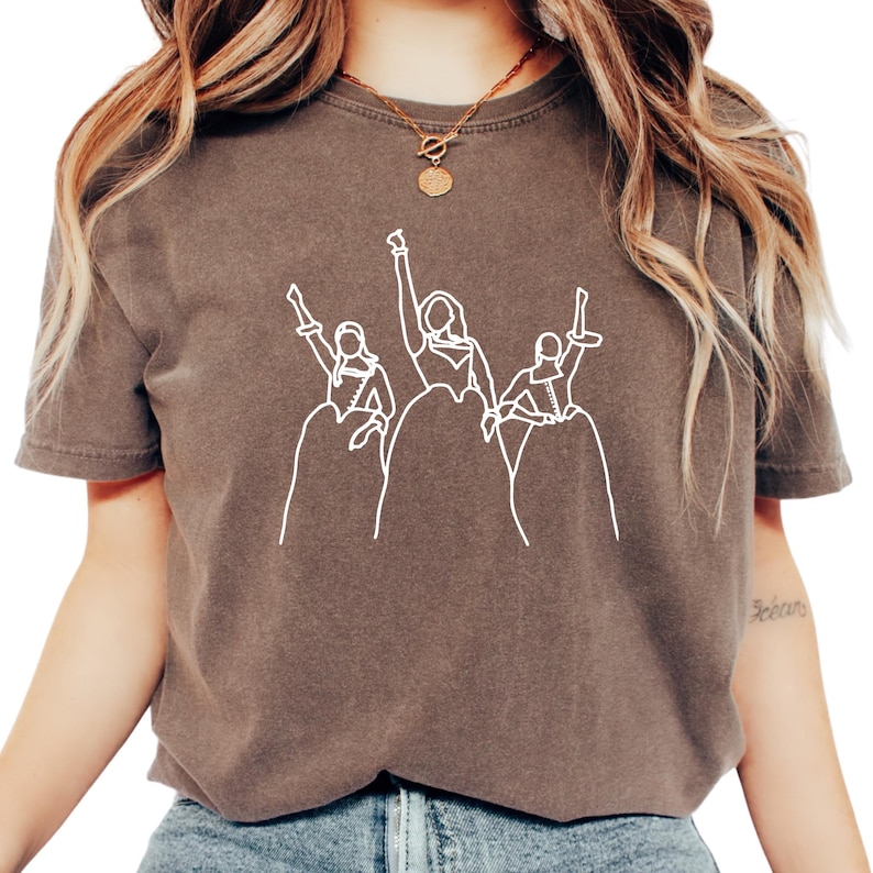 a woman wearing a star wars t - shirt
