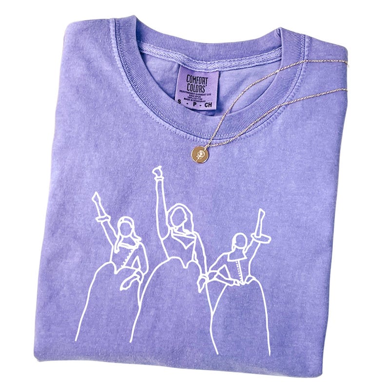 a t - shirt with a picture of a group of people on it